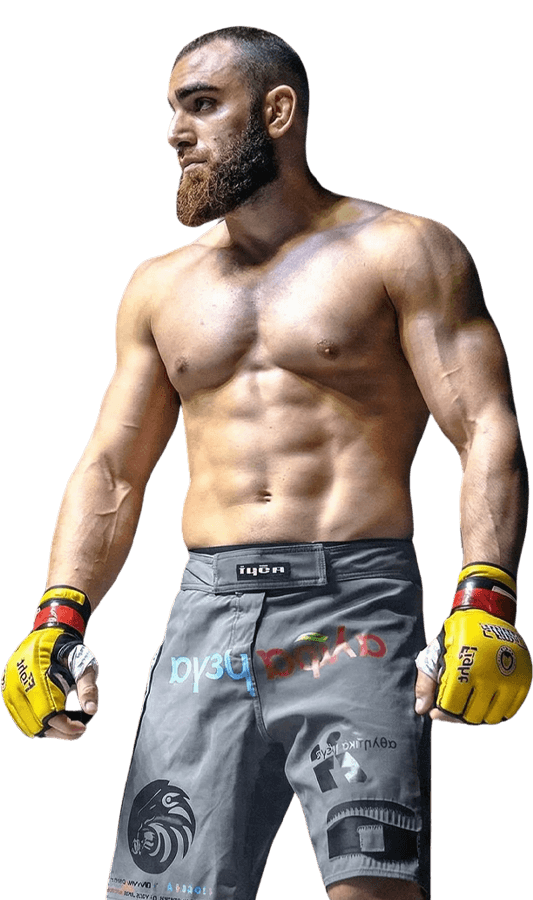 Andreas Tricomitis standing in the cage before a professional MMA bout