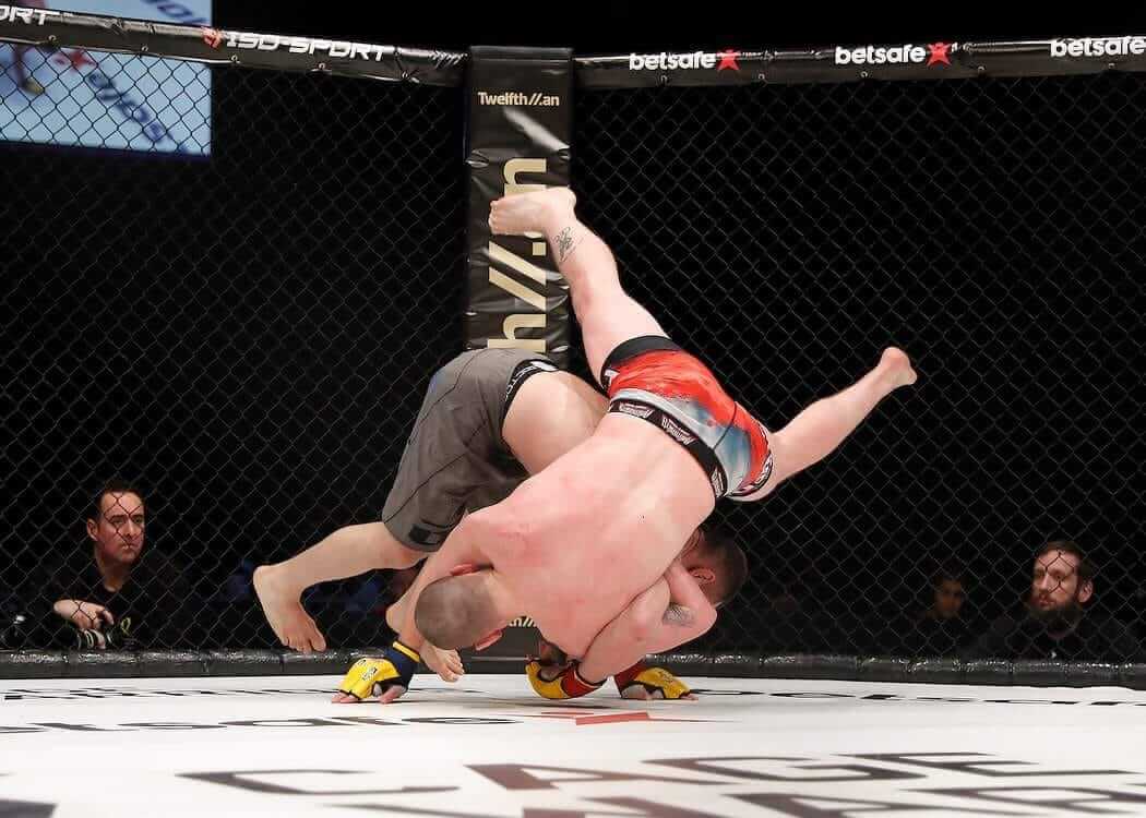 Andreas Tricomitis slamming his opponent with a judo throw at Cage Warriors 90 on UFC Fight Pass
