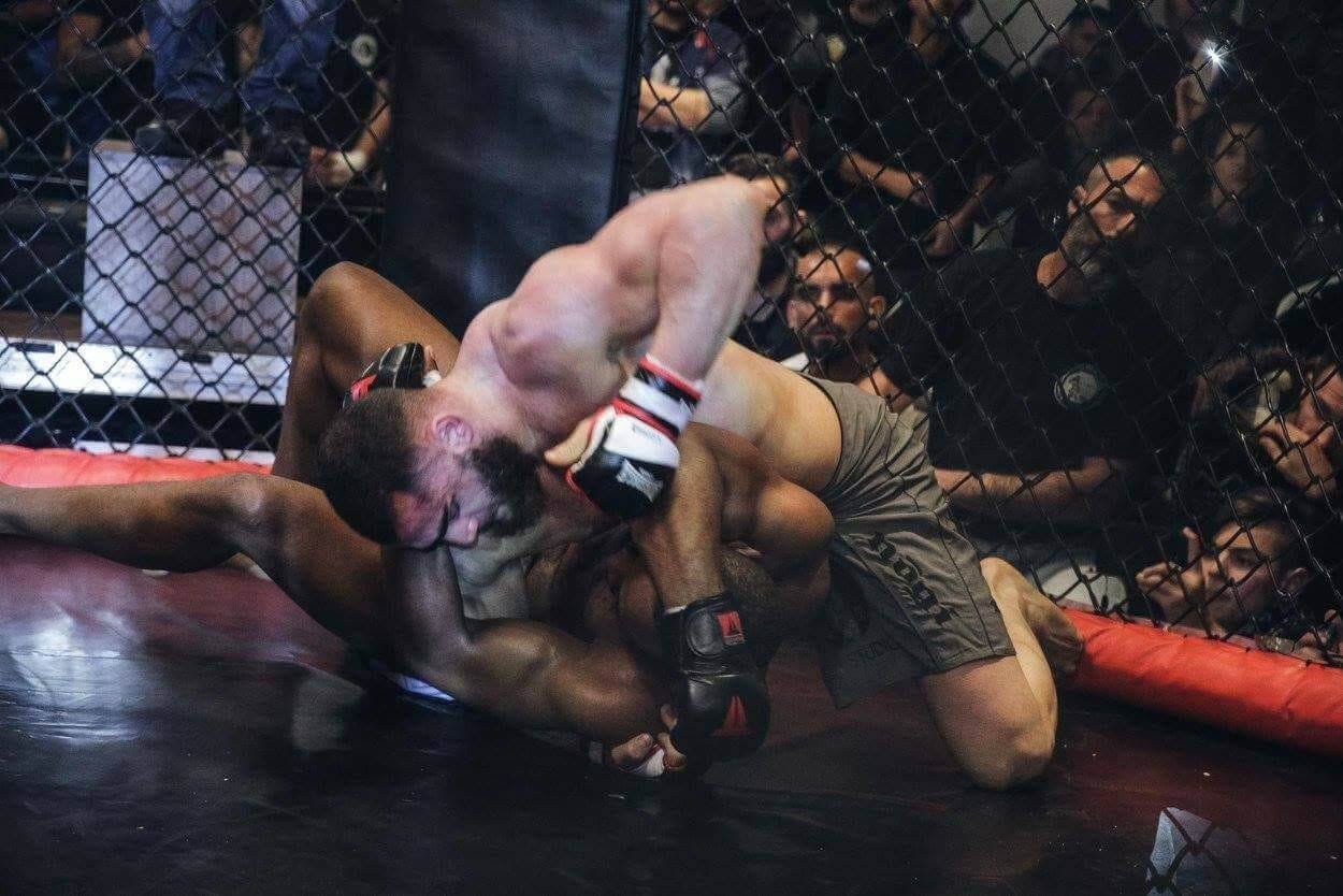 Andreas Tricomitis controlling his opponent on the ground during his PFC title fight in Cyprus