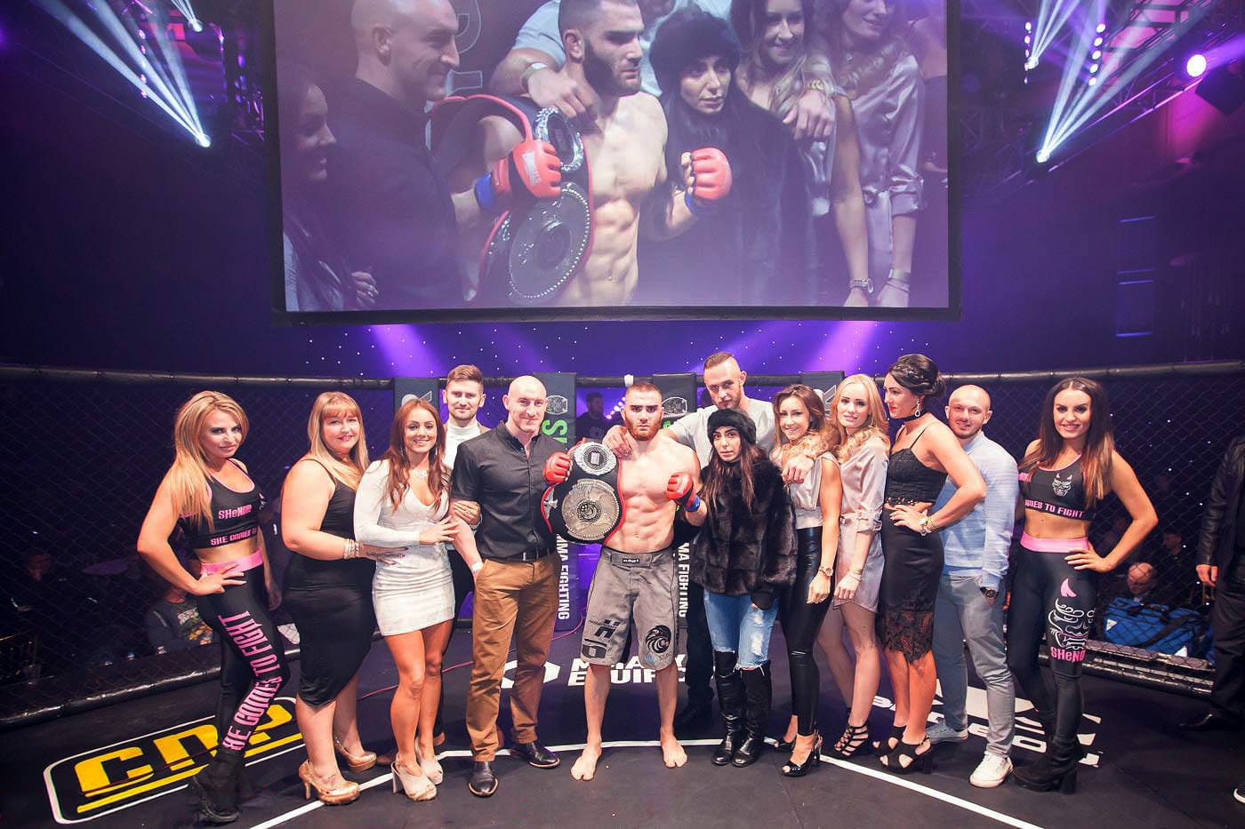 Andreas Tricomitis holding his Shinobi world amateur MMA championship belt with his team after the title win